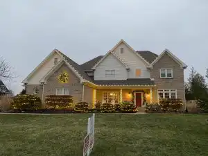 House Decorated With Colorful Christmas Lights During The Holiday Season