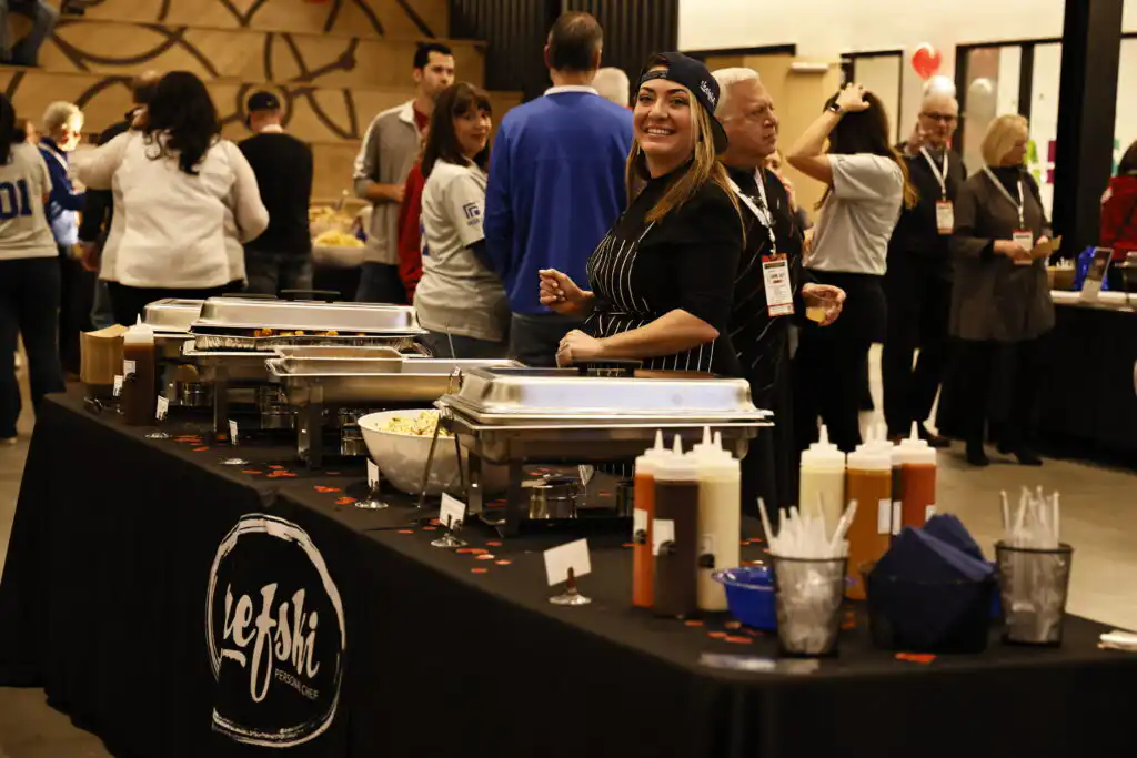 Shelby serving guests at Chefski’s catered NCAA corporate event in Carmel Indiana