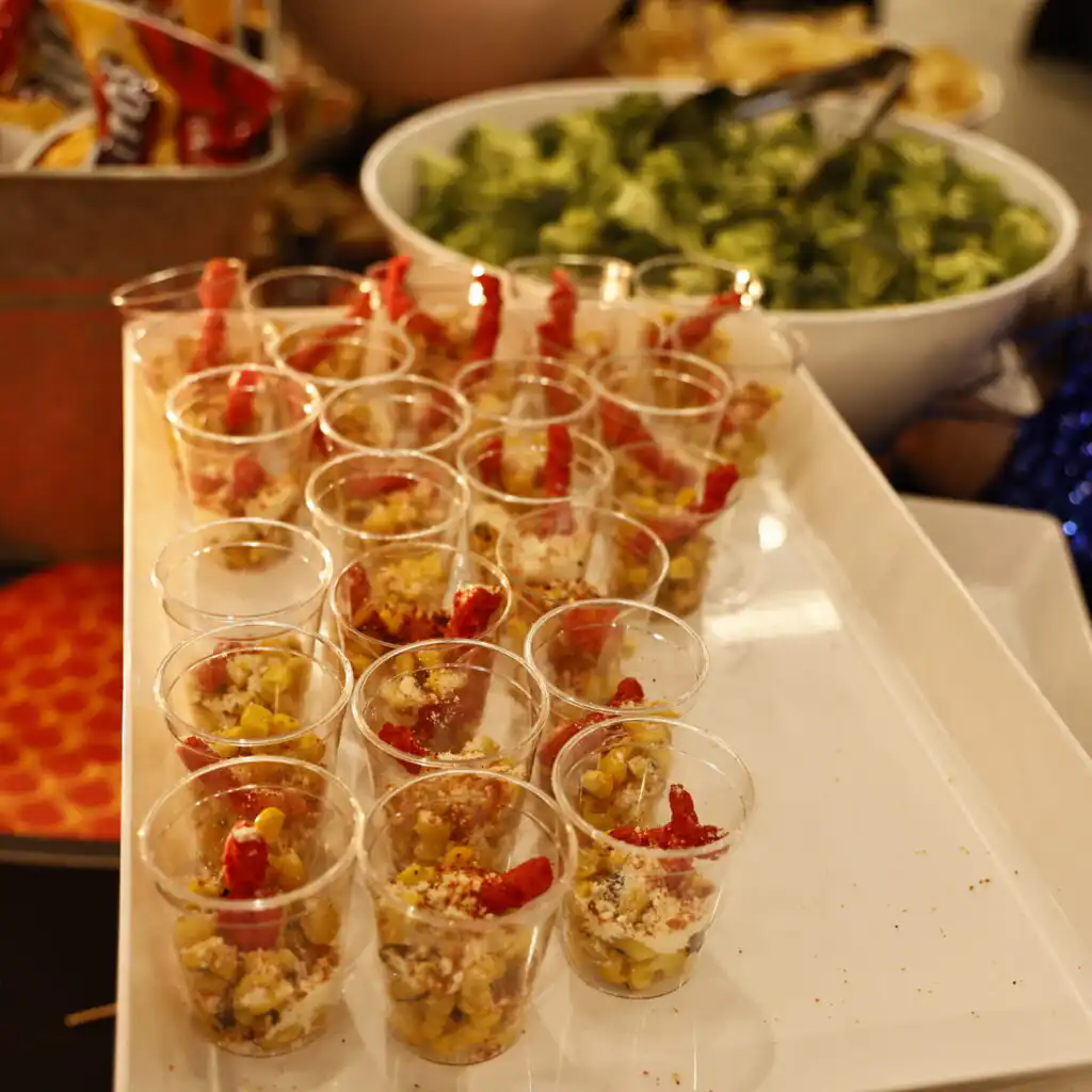 Upscale NCAA event catering display featuring gourmet appetizers and plated dishes prepared by Chefski in Indianapolis